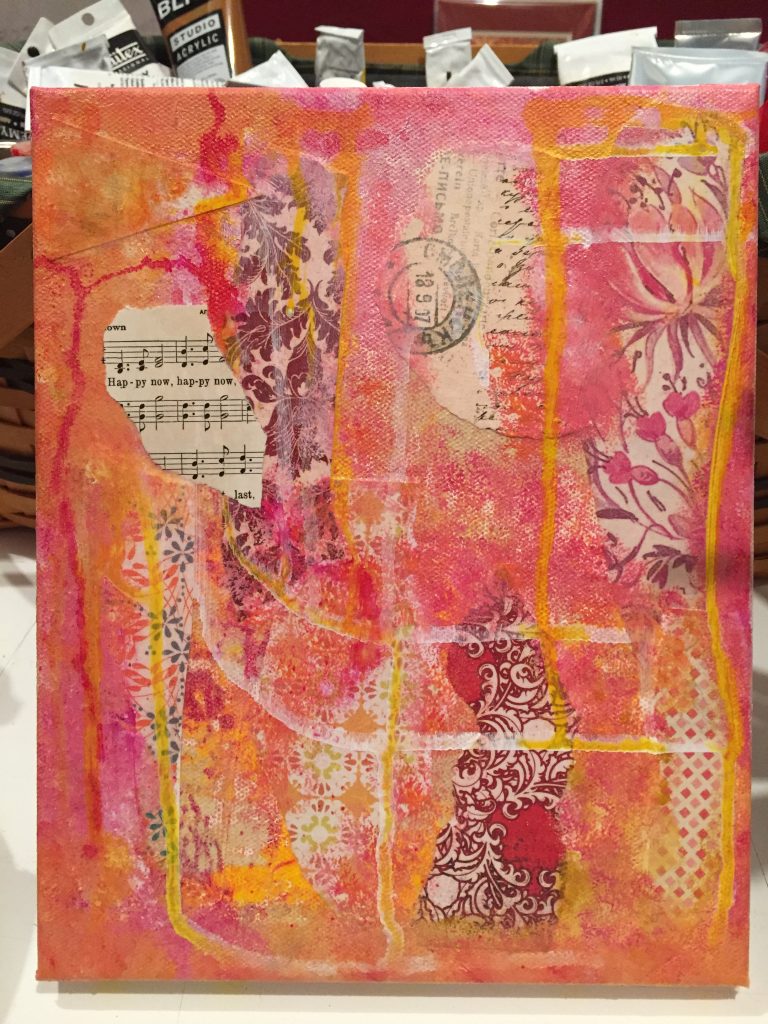 the first layer of the surrender angel collage that is simply papers and paint