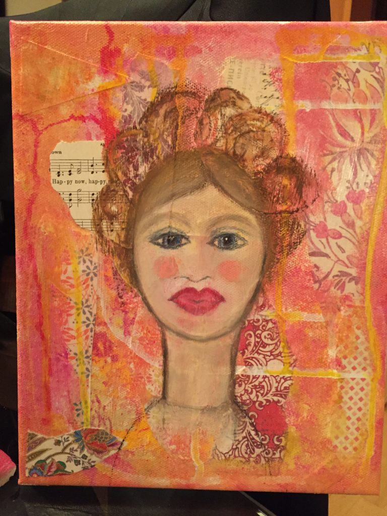 the first layer of a collage is topped with the initial drawing of a lady's face