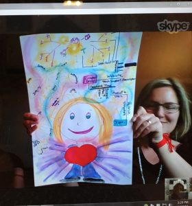 Joelle and her piece of art created from one of Joan Jakel's programs
